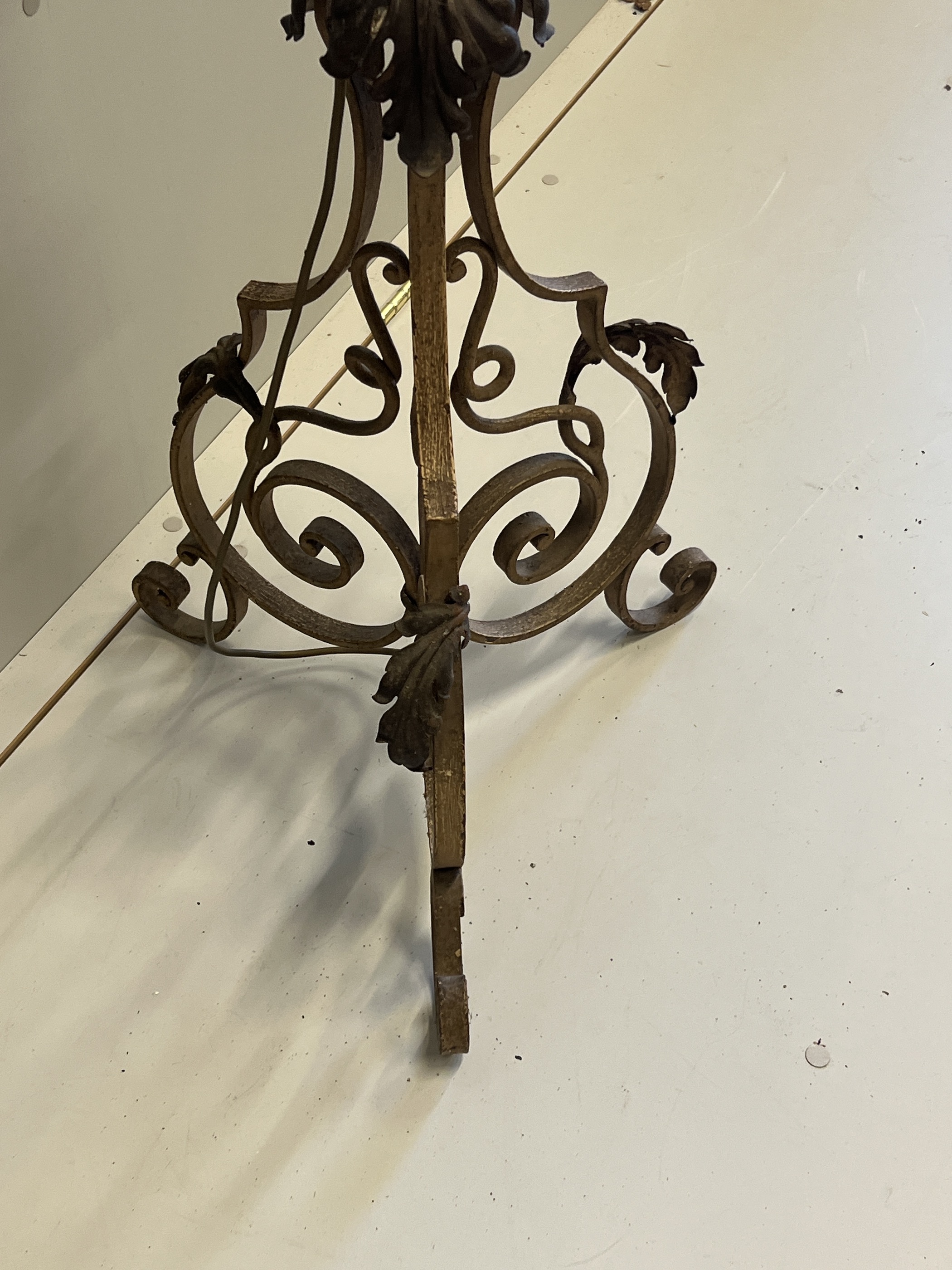 An early 20th century French wrought iron telescopic standard lamp